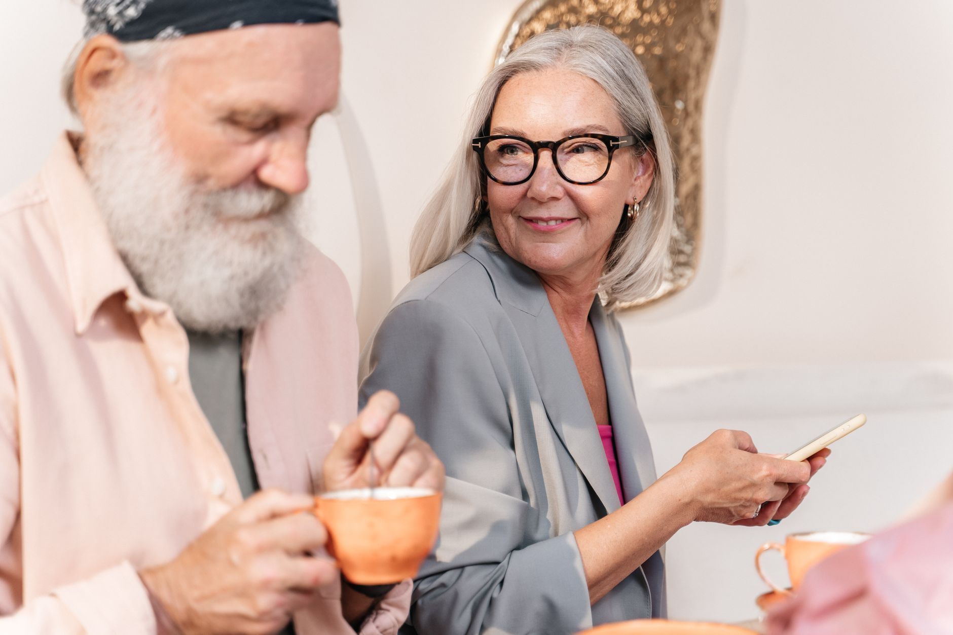 A carer and an older man going through a weekly plan at a table